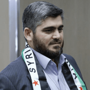 hnc-negotiator-mohammed-alloush-arrives-geneva..jpg